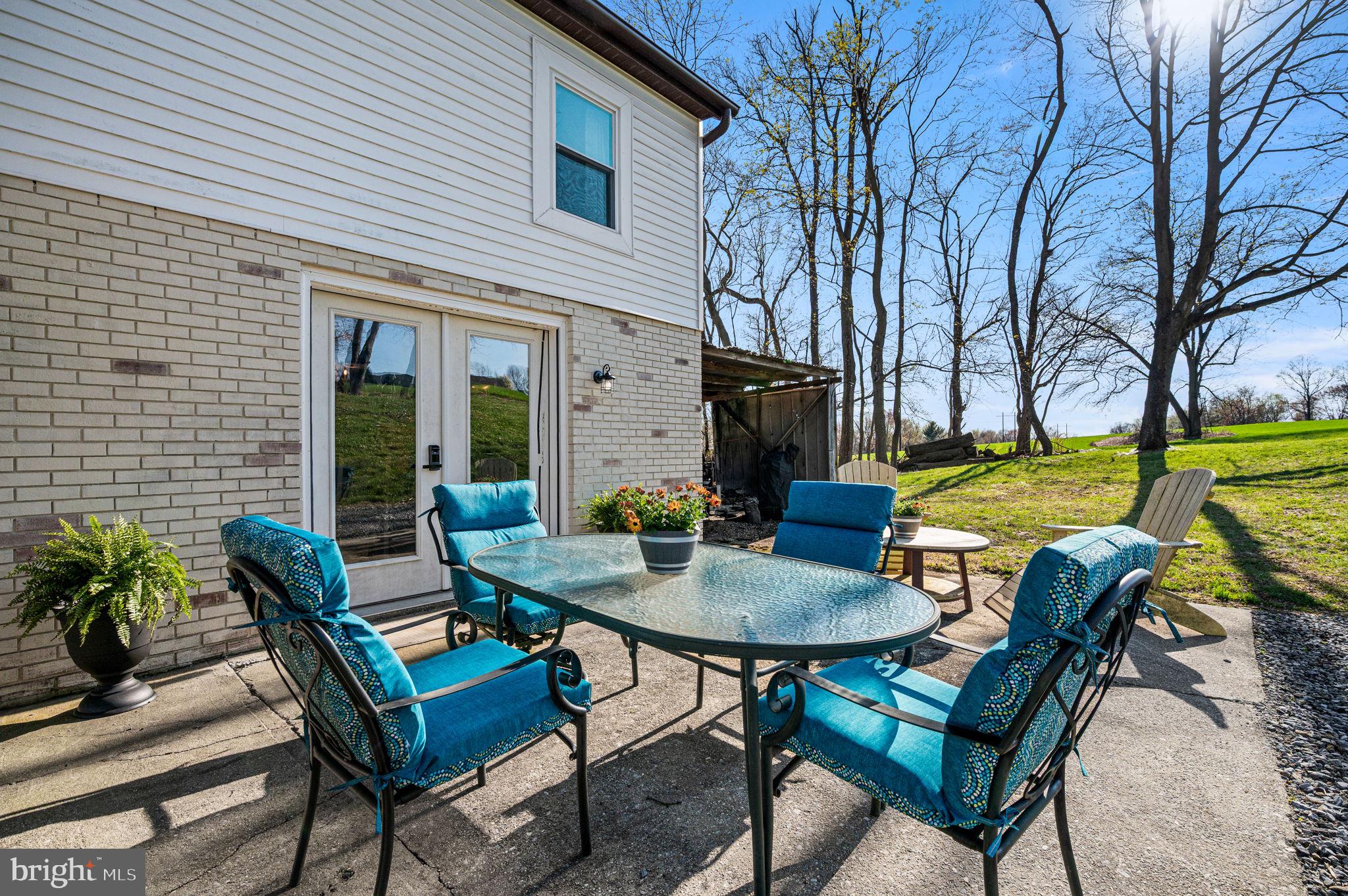 1725 Goosetown Road Coatesville, PA 19320 - Photo 13 of 34 a view of an outdoor space with table and chairs