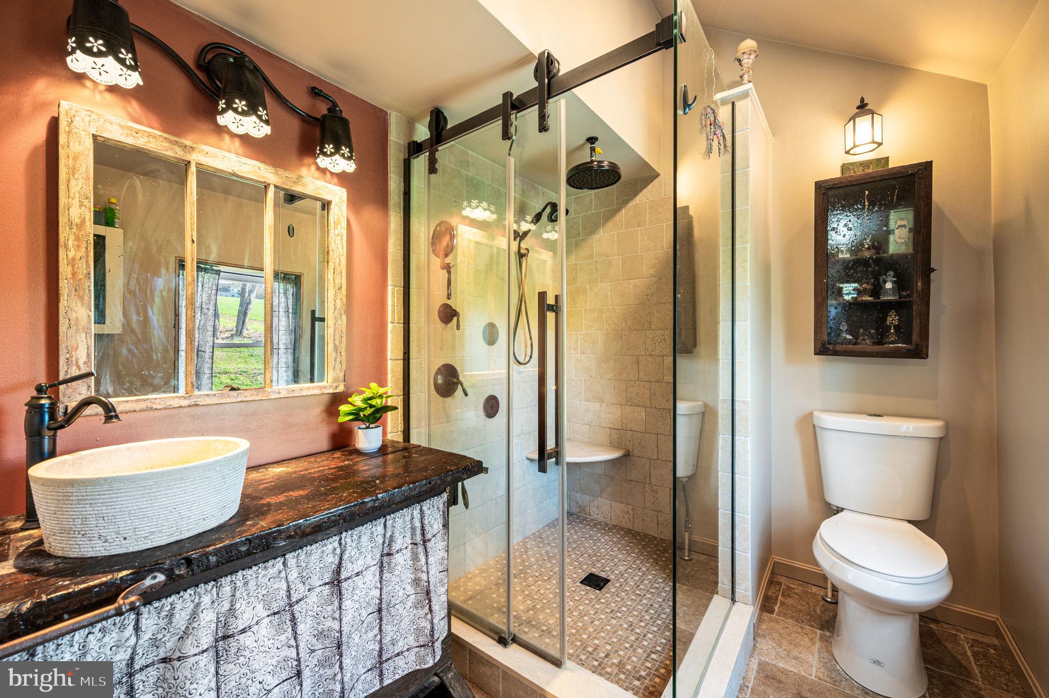 1725 Goosetown Road Coatesville, PA 19320 - Photo 10 of 34 a bathroom with a granite countertop sink toilet and shower