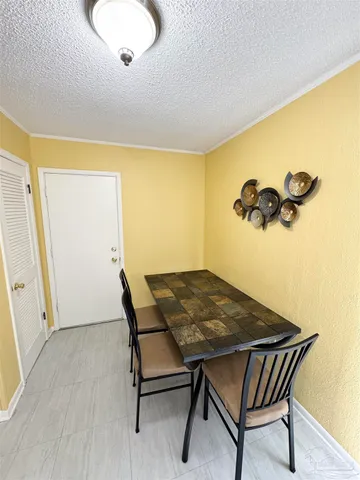 a view of a room with furniture and wooden floor