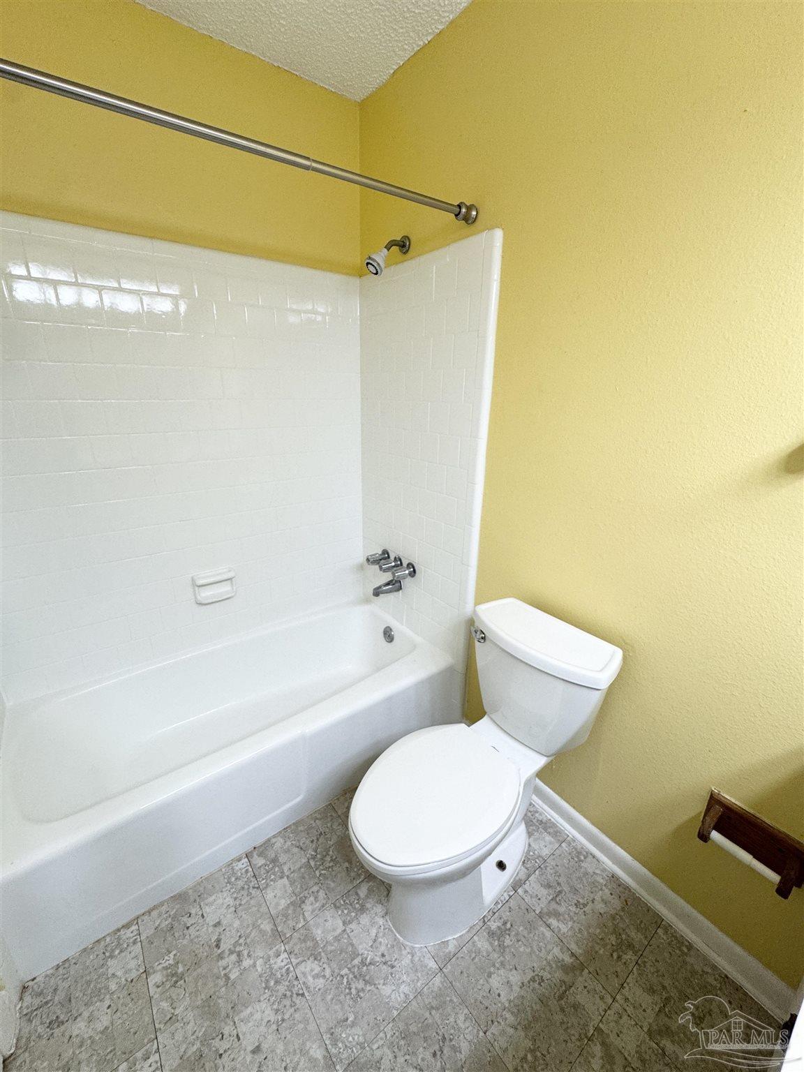 6320 Denver Avenue Pensacola, FL 32526 - Photo 20 of 28 a white toilet sitting next to a bath tub and a shower