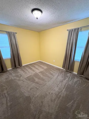 an empty room with a mirror