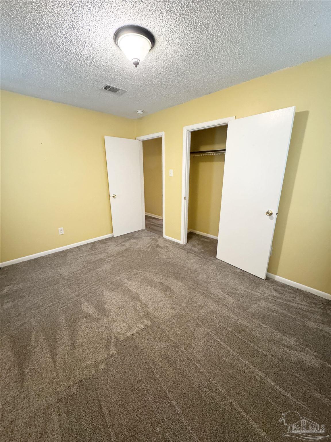 6320 Denver Avenue Pensacola, FL 32526 - Photo 22 of 28 an empty room with a natural light