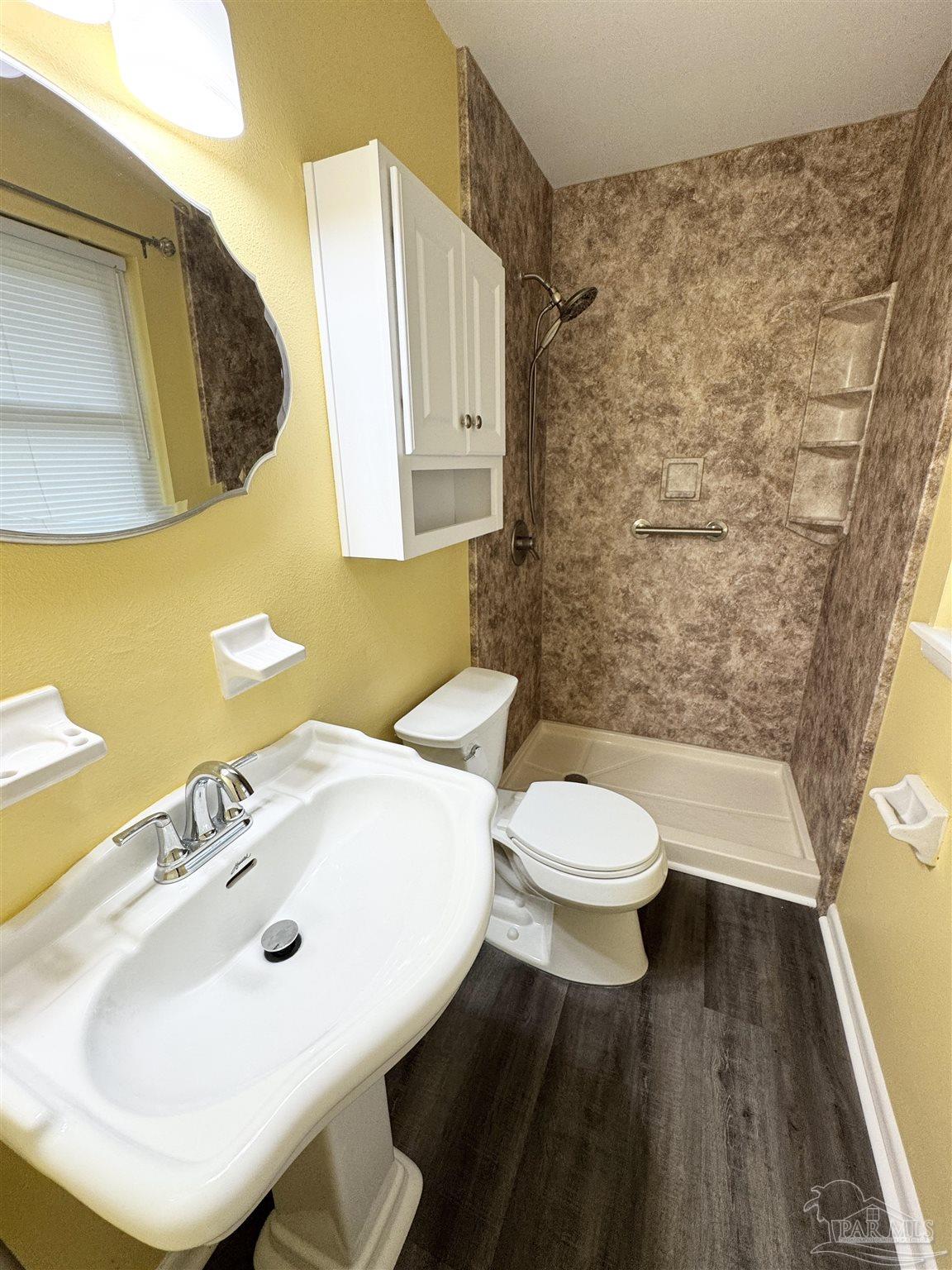 6320 Denver Avenue Pensacola, FL 32526 - Photo 25 of 28 a bathroom with a sink and a mirror
