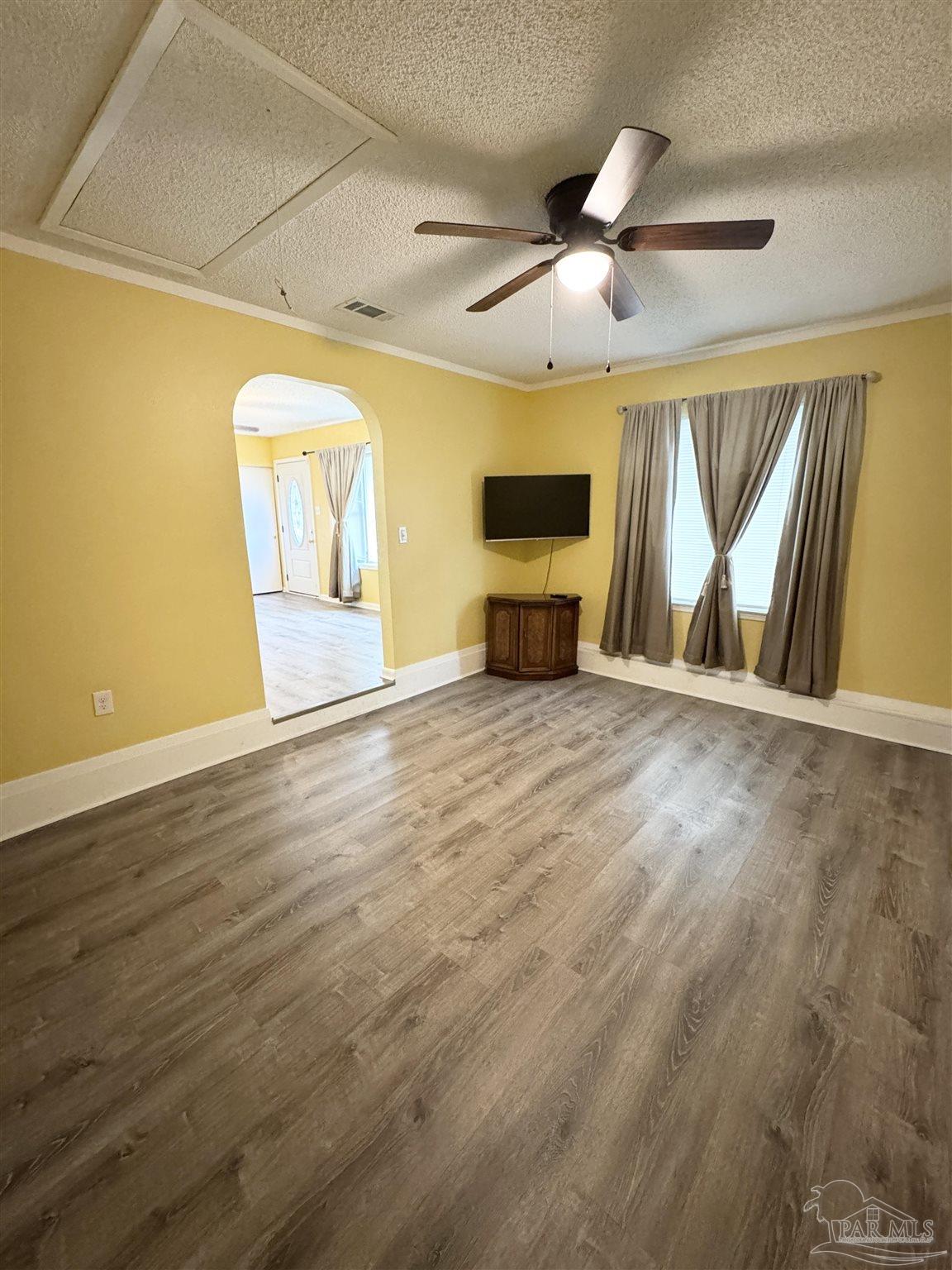 6320 Denver Avenue Pensacola, FL 32526 - Photo 6 of 28 a view of an empty room with a window