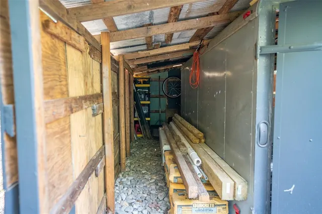 a view of backyard with furniture and a cabin