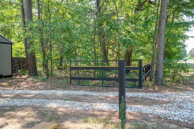 a view of a bench in a backyard