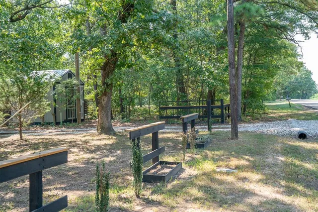 a view of a bench in a backyard
