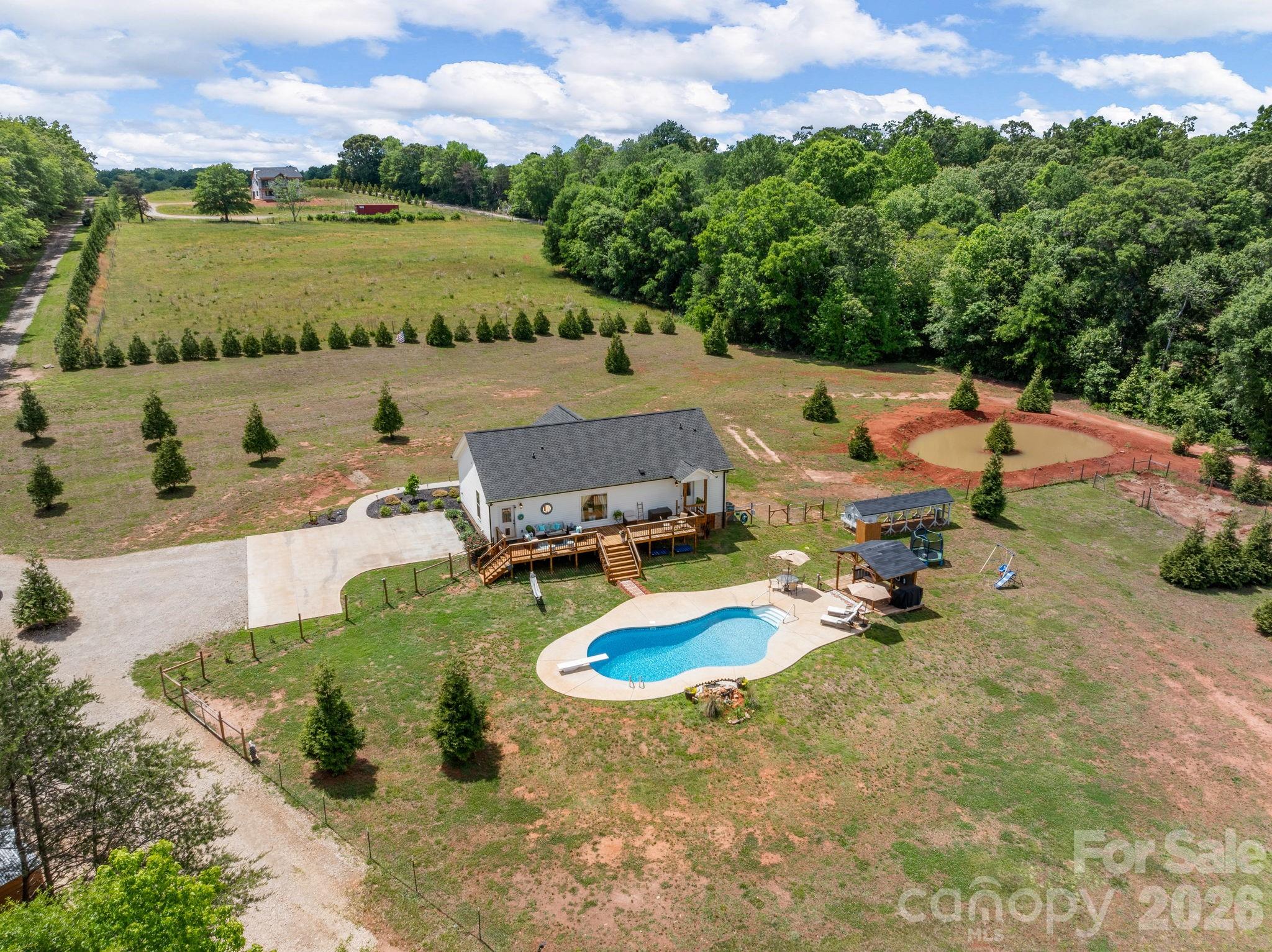 1076 McSwain Road Chesnee, SC 29323 - Photo 29 of 36 an aerial view of a house with outdoor space