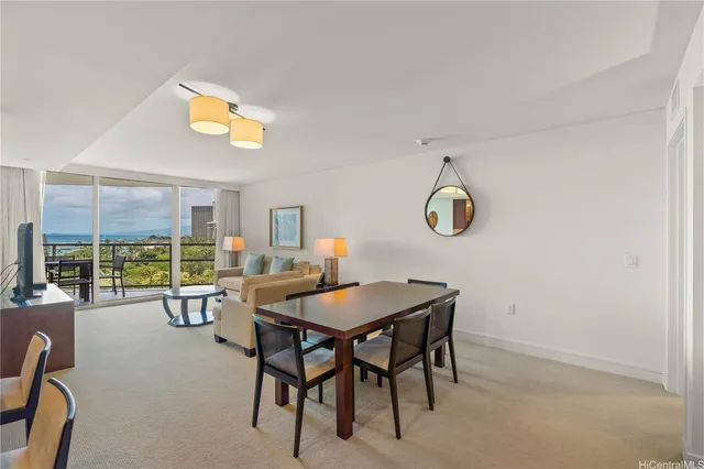 a view of a dining room with furniture and window