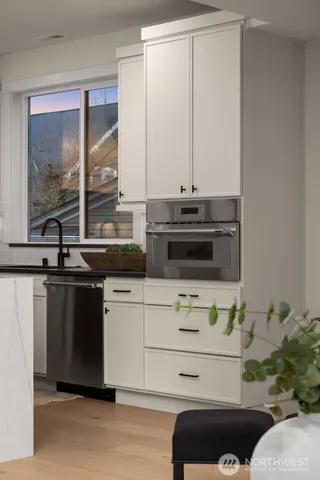 a kitchen with a stove and a sink