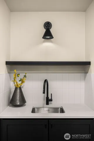 a close view of sink and cabinets