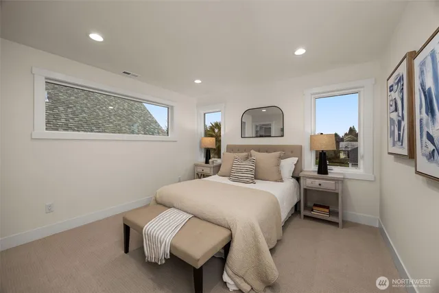 a bedroom with a bed and a couch