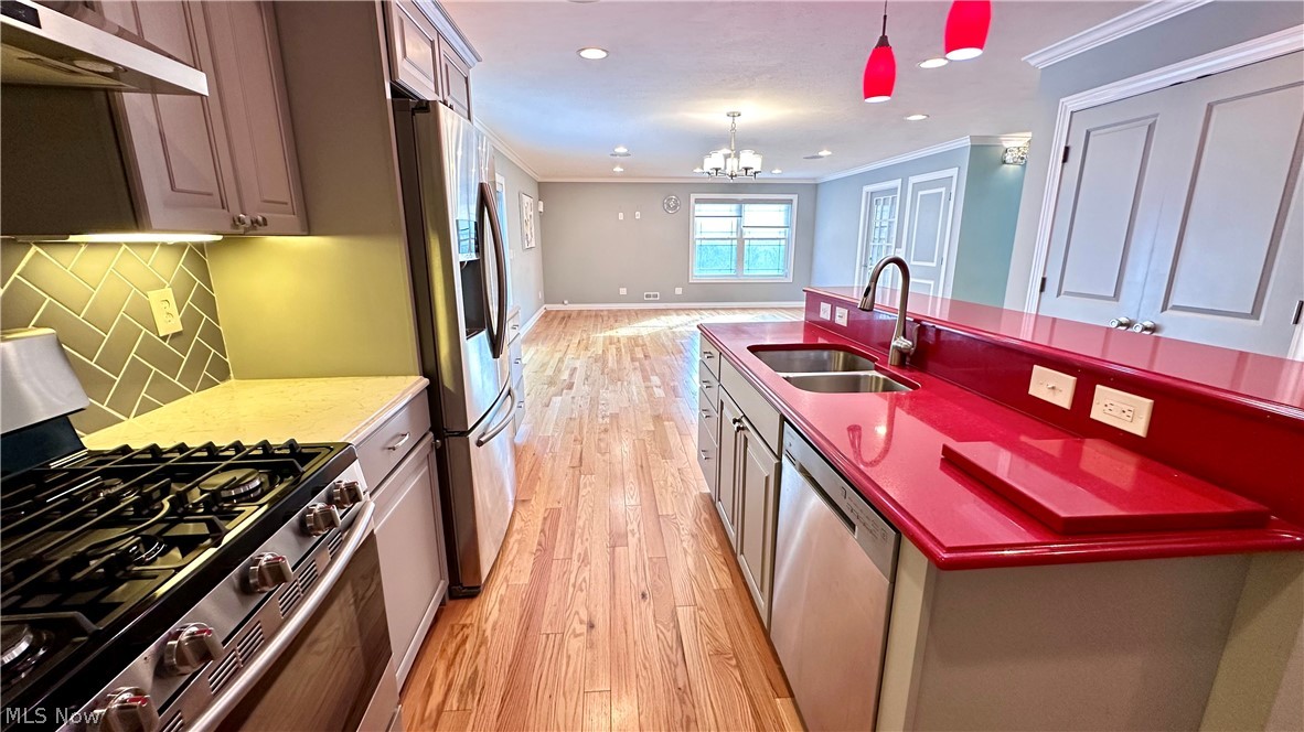 2603 Rockefeller Road Wickliffe, OH 44092 - Photo 9 of 34 Kitchen featuring red countertop, stainless steel double basin sink, and stainless steel appliances