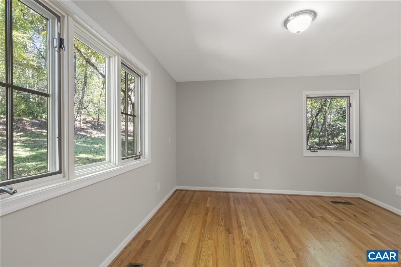 285 Turkey Ridge Road Charlottesville, VA 22903 - Photo 15 of 28 wooden floor in an empty room with a window