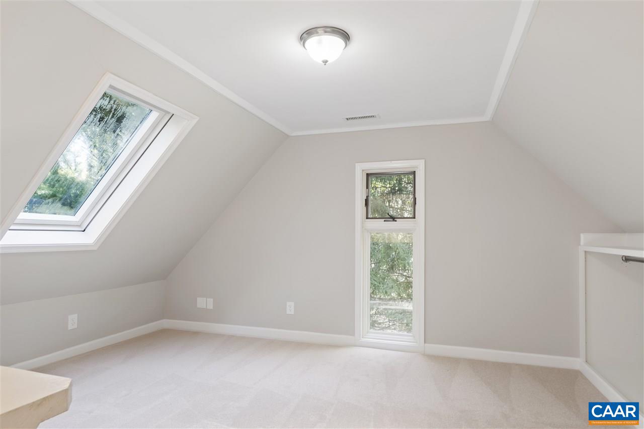 285 Turkey Ridge Road Charlottesville, VA 22903 - Photo 24 of 28 an empty room with windows