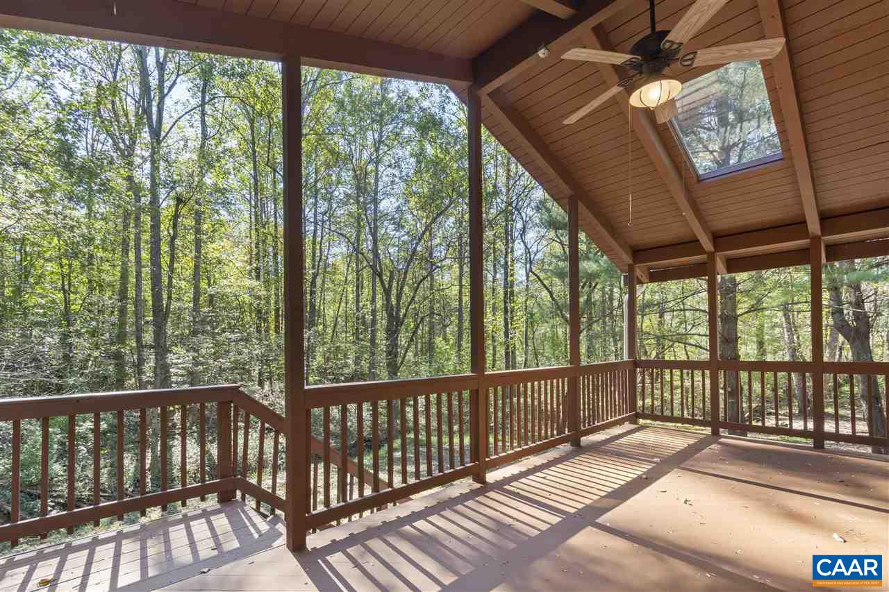 285 Turkey Ridge Road Charlottesville, VA 22903 - Photo 8 of 28 a view of balcony with furniture and garden