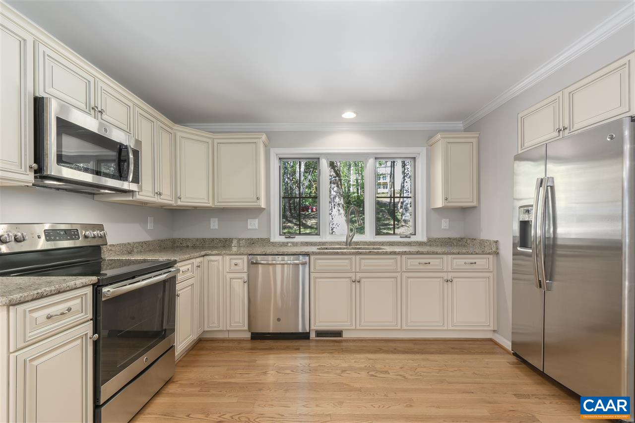 285 Turkey Ridge Road Charlottesville, VA 22903 - Photo 10 of 28 a kitchen with stainless steel appliances granite countertop a stove a sink and a microwave