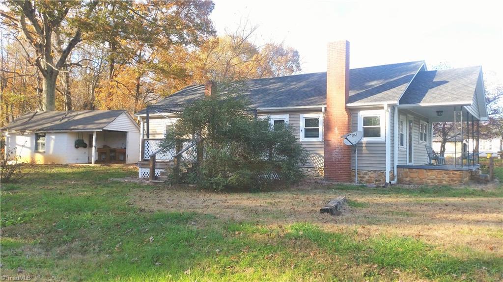 172 Guy Crouse Road Traphill, NC 28685 - Photo 3 of 17 side entrance with deck & concrete block storage