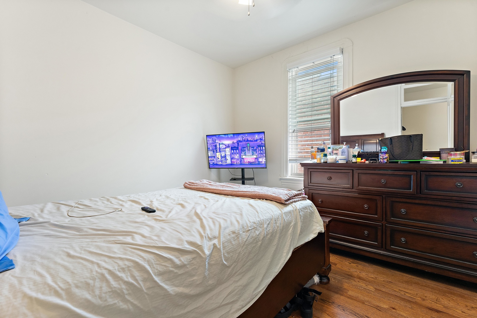 1132 East 44th Street Chicago, IL 60653 - Photo 14 of 23 a bedroom with a bed and a dresser