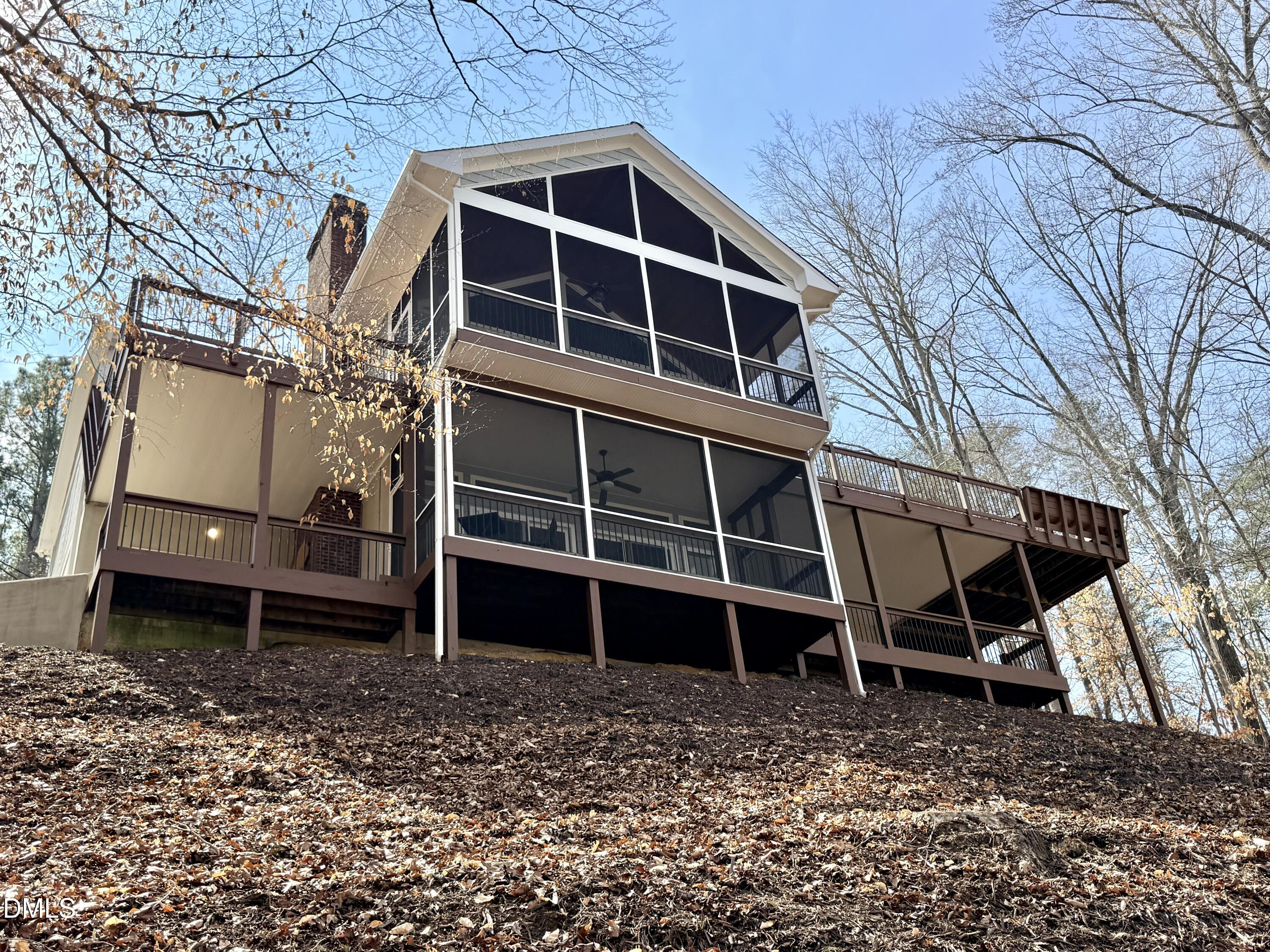 250 Bunny Rabbit Road Leasburg, NC 27291 - Photo 1 of 66 a view of a house with a yard and wooden fence