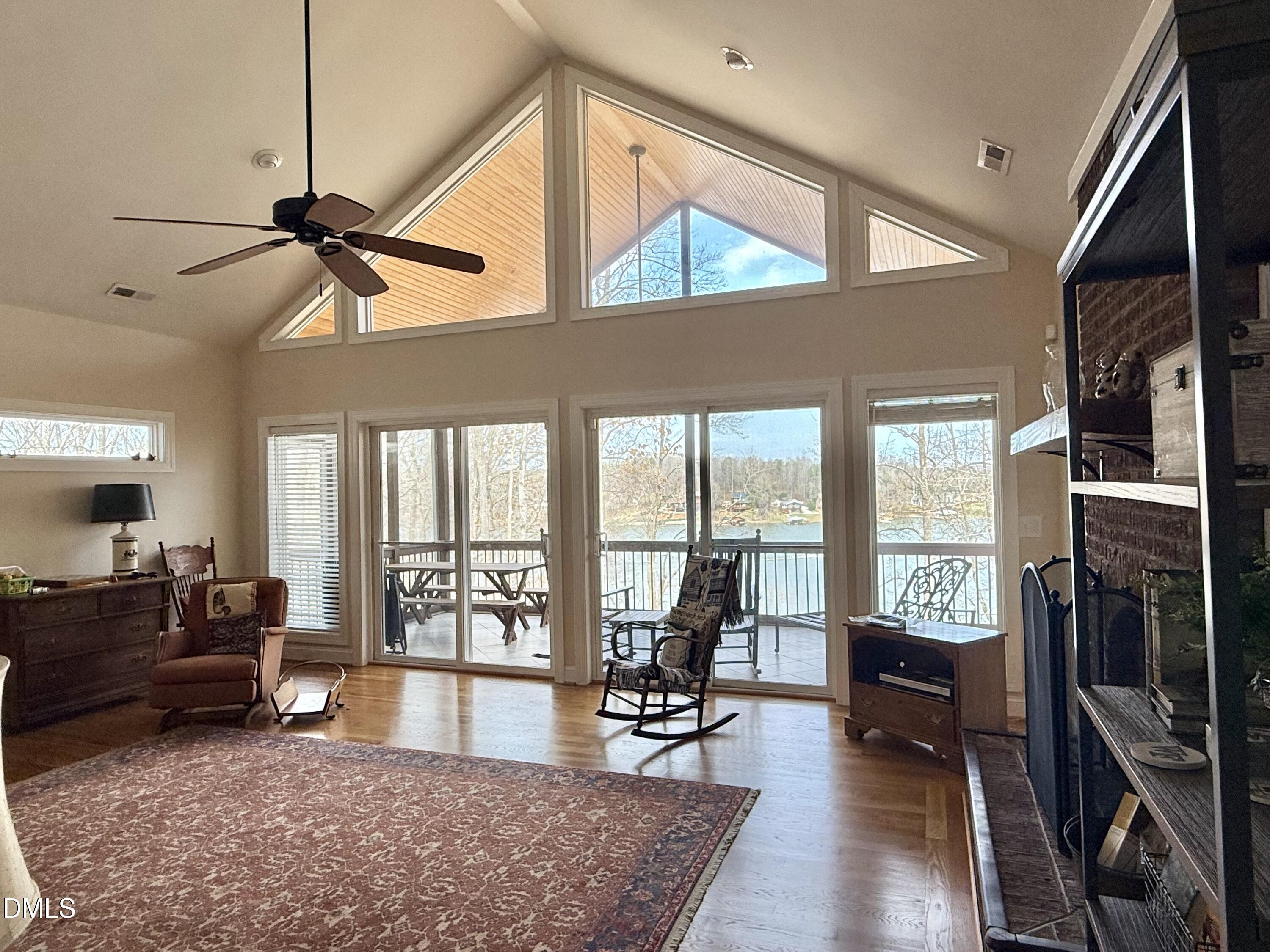 250 Bunny Rabbit Road Leasburg, NC 27291 - Photo 15 of 66 a living room with furniture a window and a flat screen tv