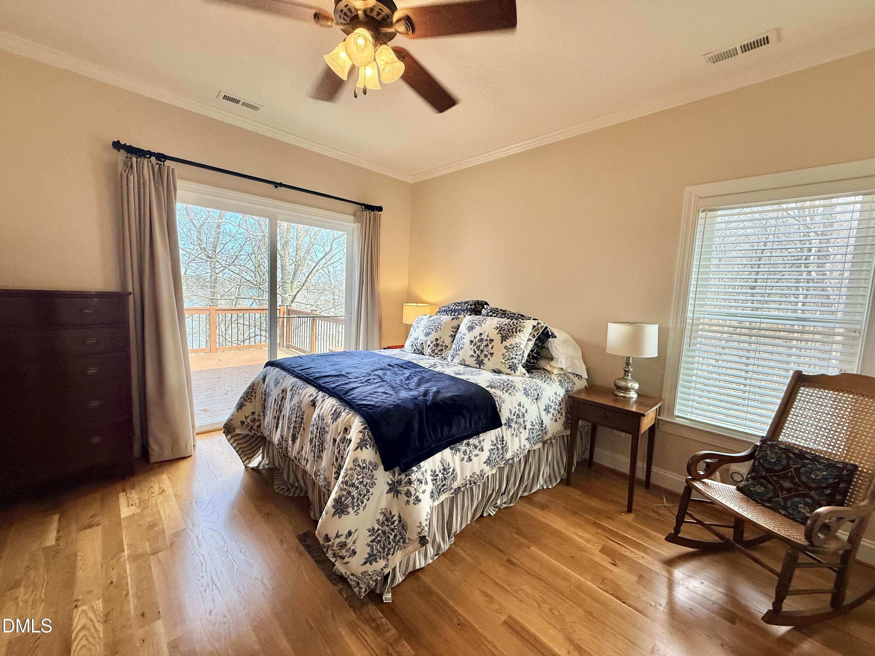 250 Bunny Rabbit Road Leasburg, NC 27291 - Photo 17 of 66 a spacious bedroom with a bed and chair
