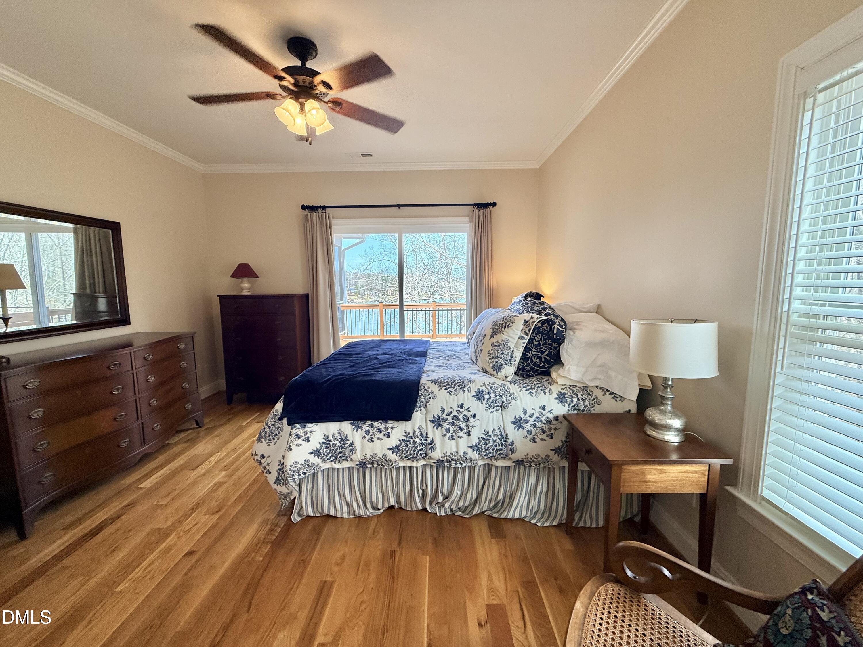 250 Bunny Rabbit Road Leasburg, NC 27291 - Photo 18 of 66 a bedroom with a bed and wooden floor