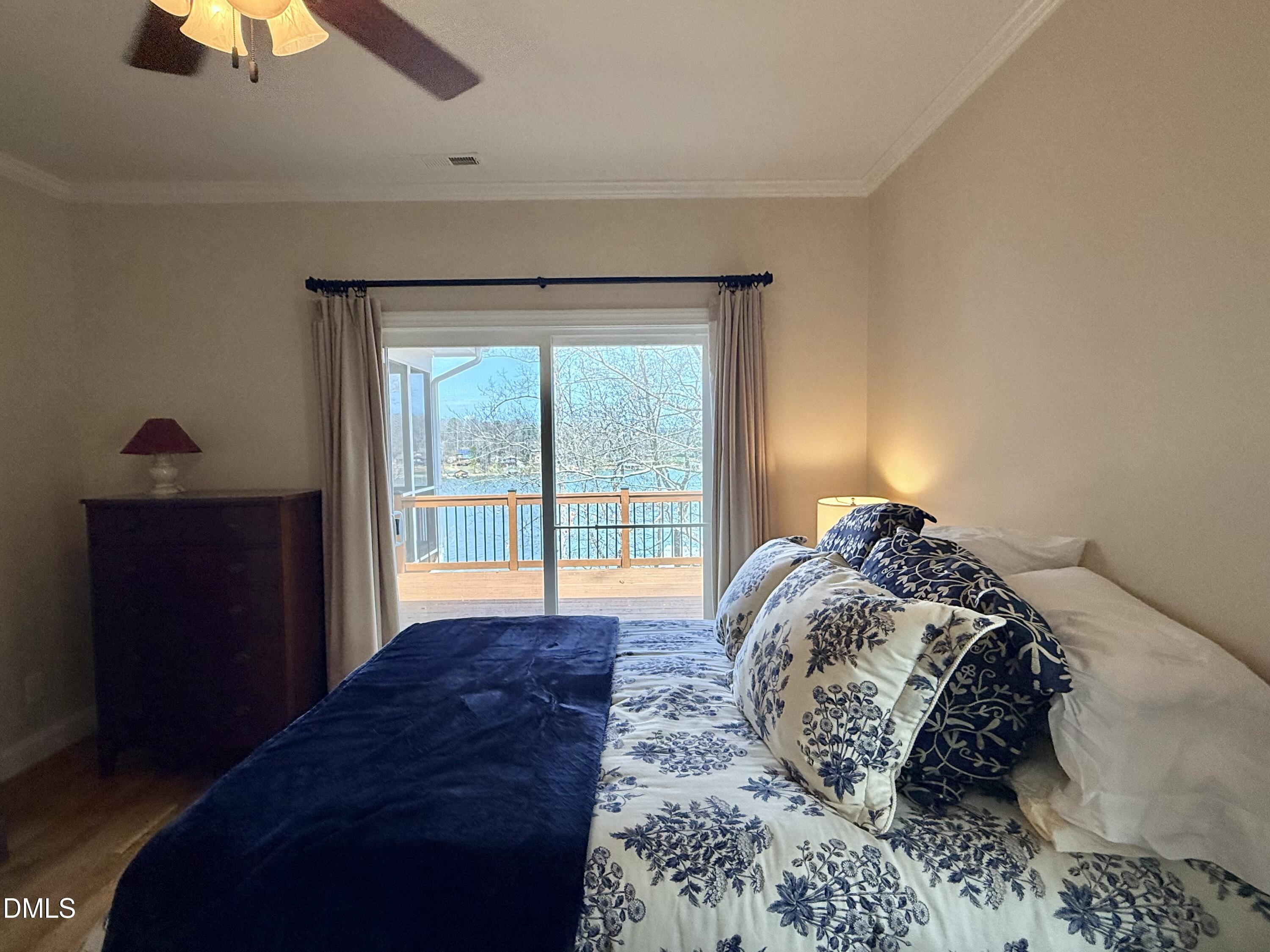 250 Bunny Rabbit Road Leasburg, NC 27291 - Photo 19 of 66 a bed sitting in a bedroom next to a window