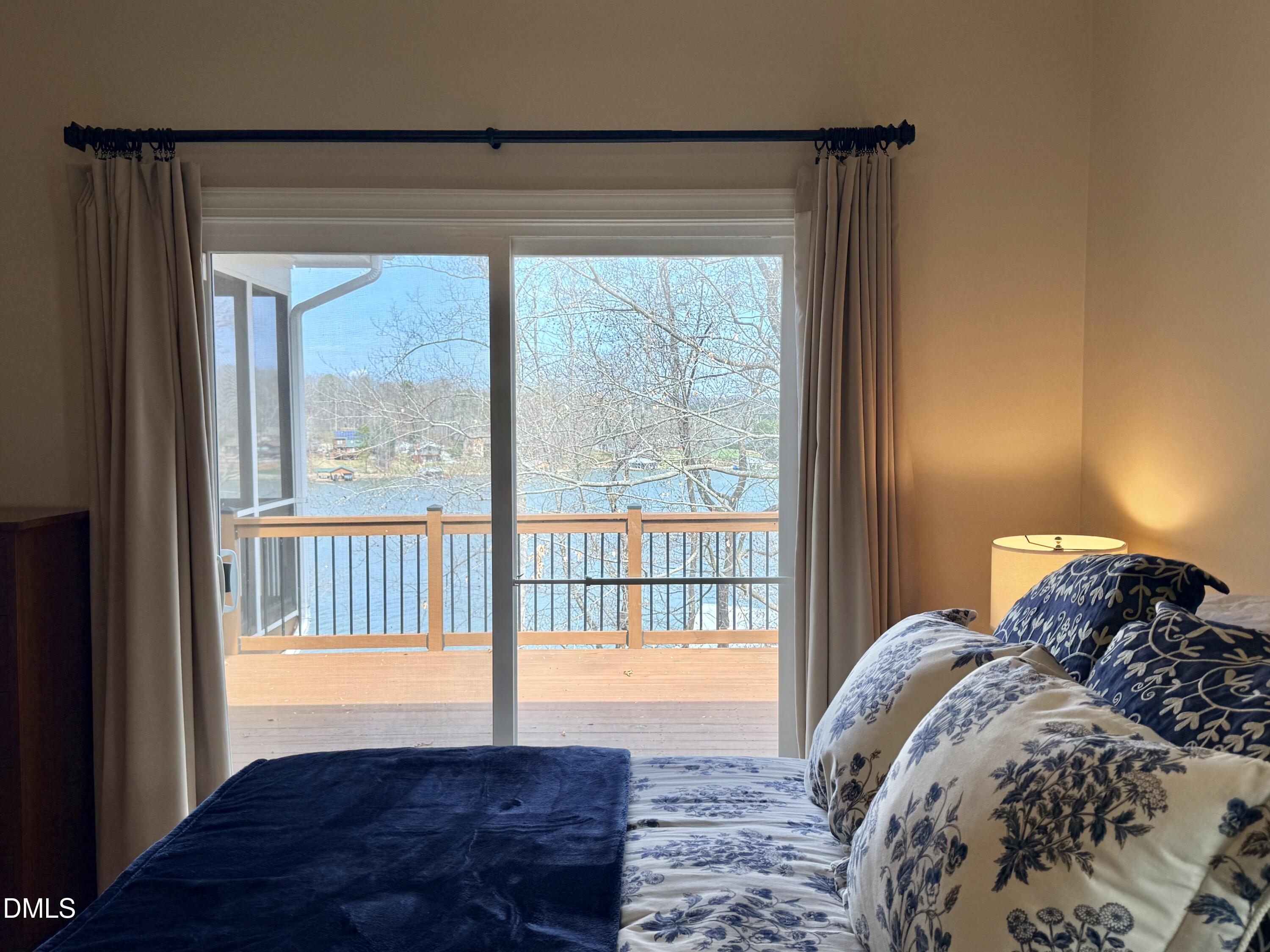 250 Bunny Rabbit Road Leasburg, NC 27291 - Photo 20 of 66 a bed sitting in a bedroom next to a window