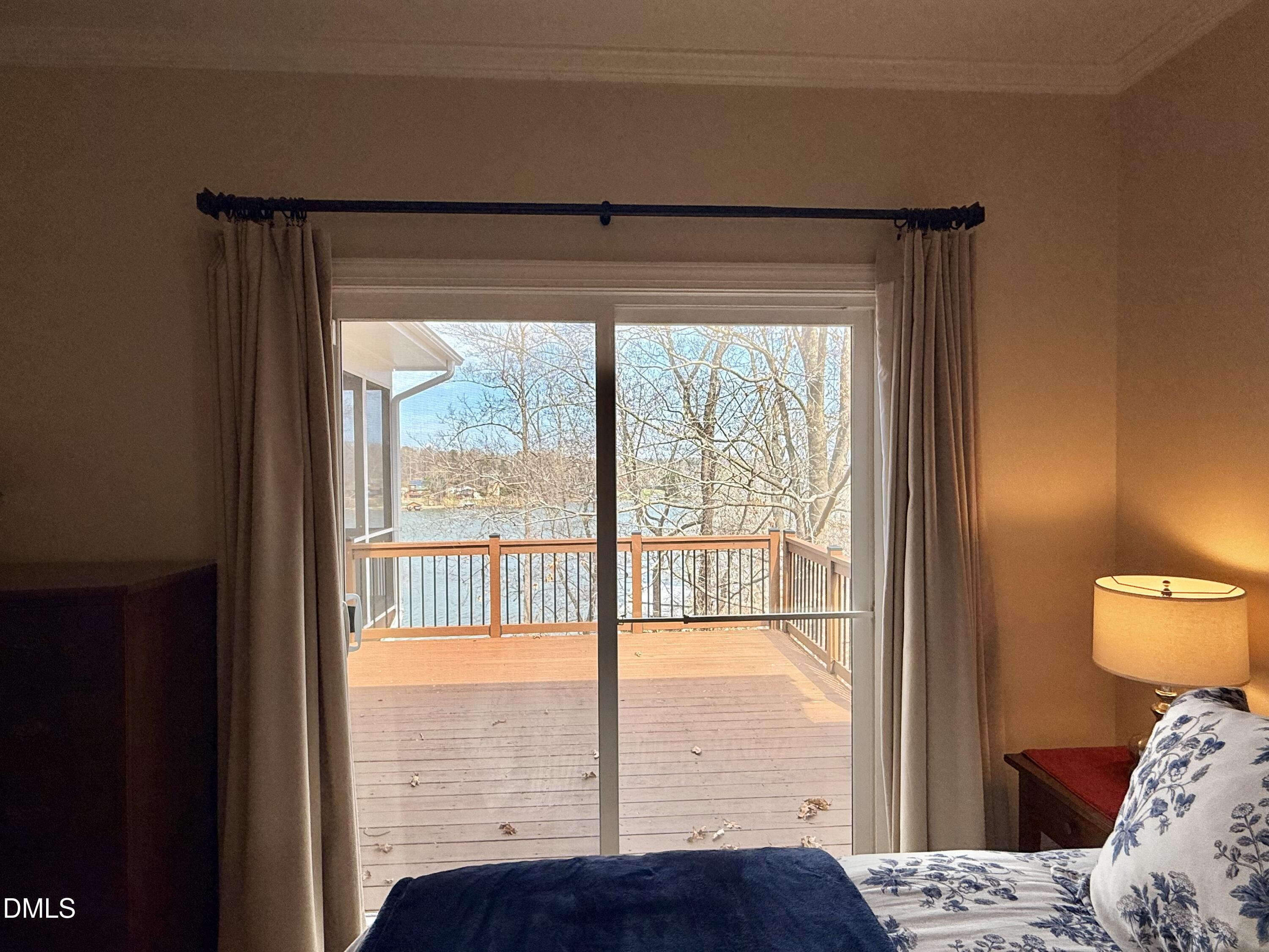 250 Bunny Rabbit Road Leasburg, NC 27291 - Photo 21 of 66 a view of a bedroom with a bed and wooden floor
