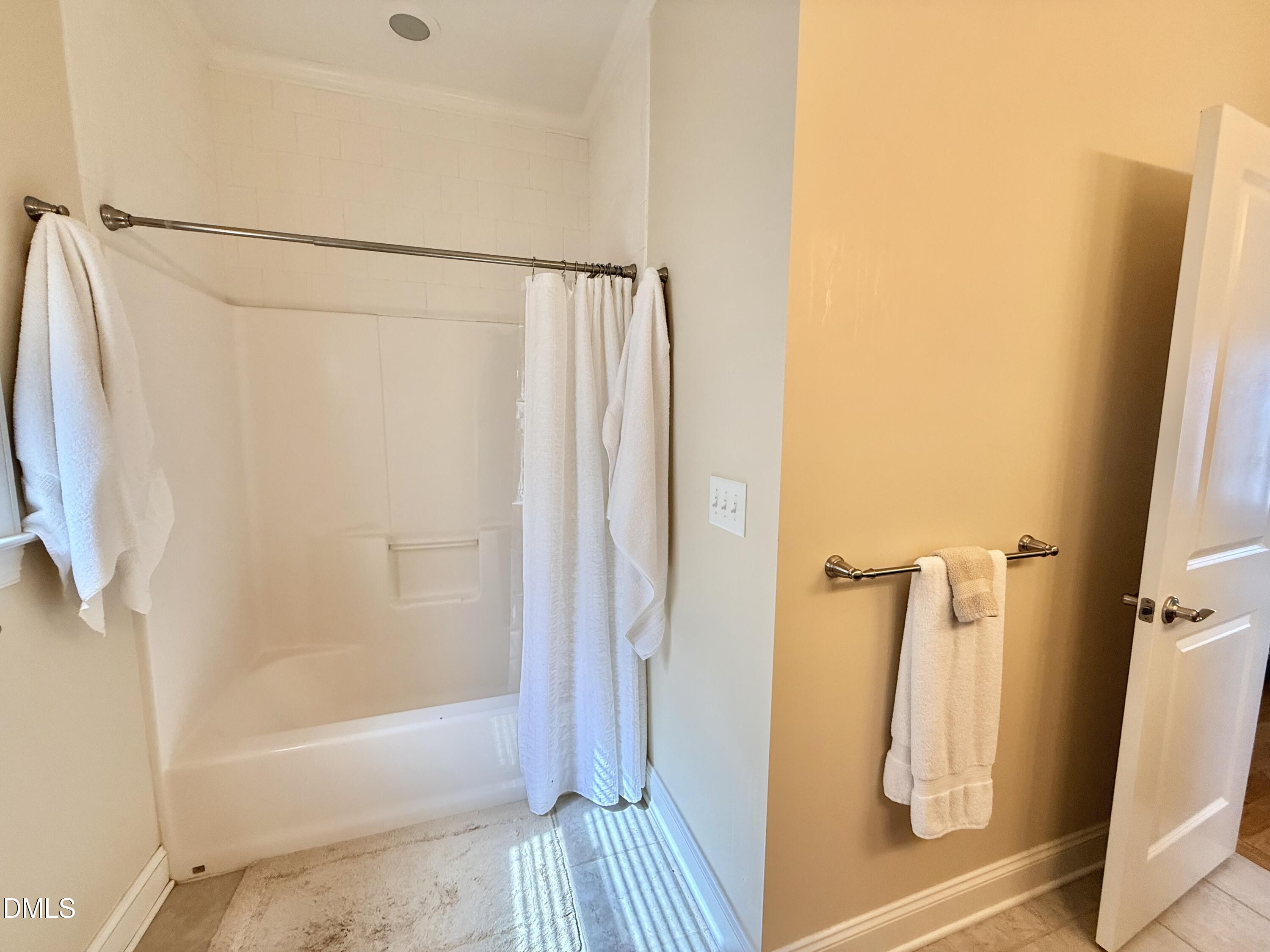 250 Bunny Rabbit Road Leasburg, NC 27291 - Photo 25 of 66 a bathroom with a shower and a tub