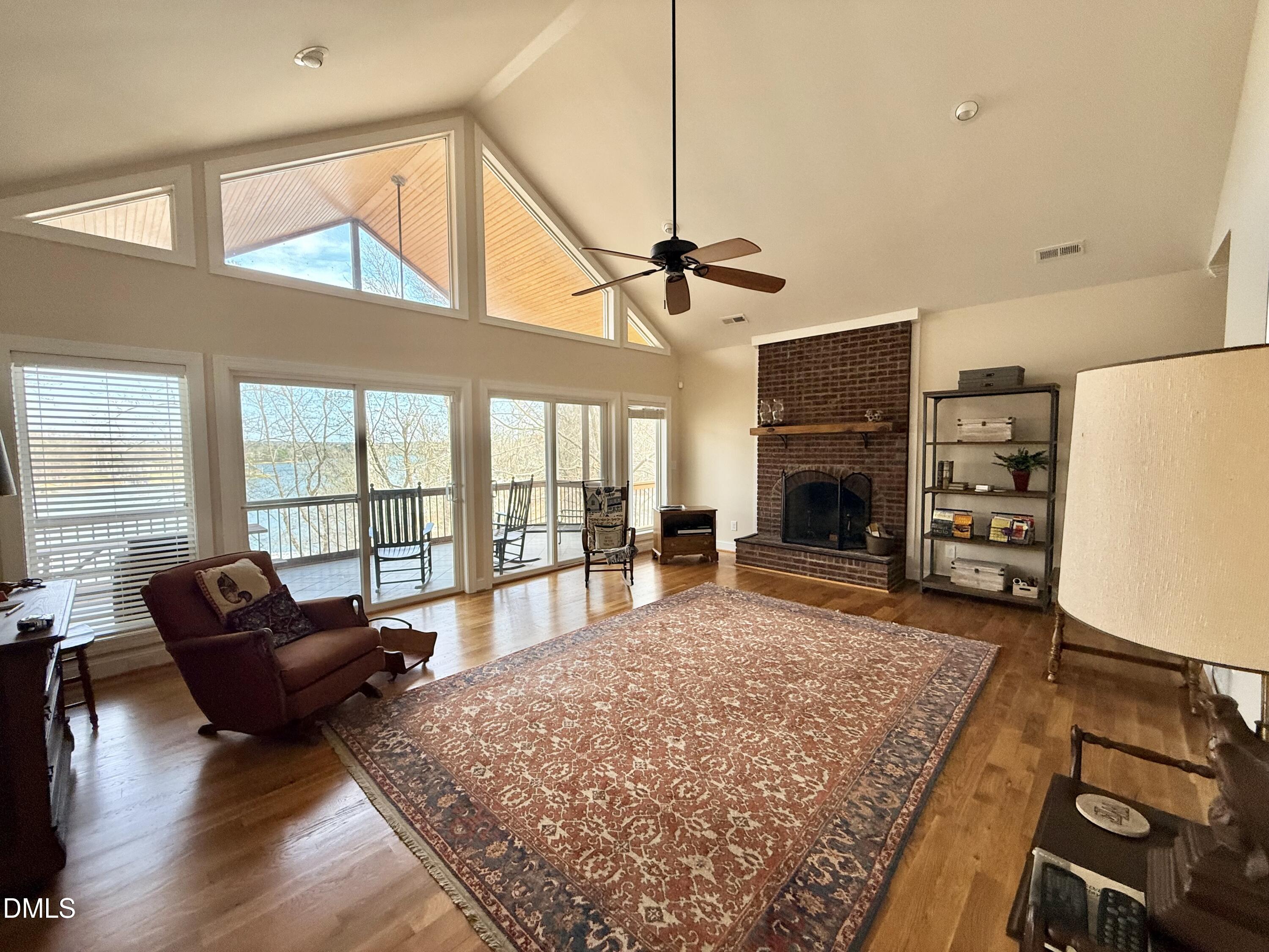 250 Bunny Rabbit Road Leasburg, NC 27291 - Photo 3 of 66 a living room with furniture large window and a flat screen tv