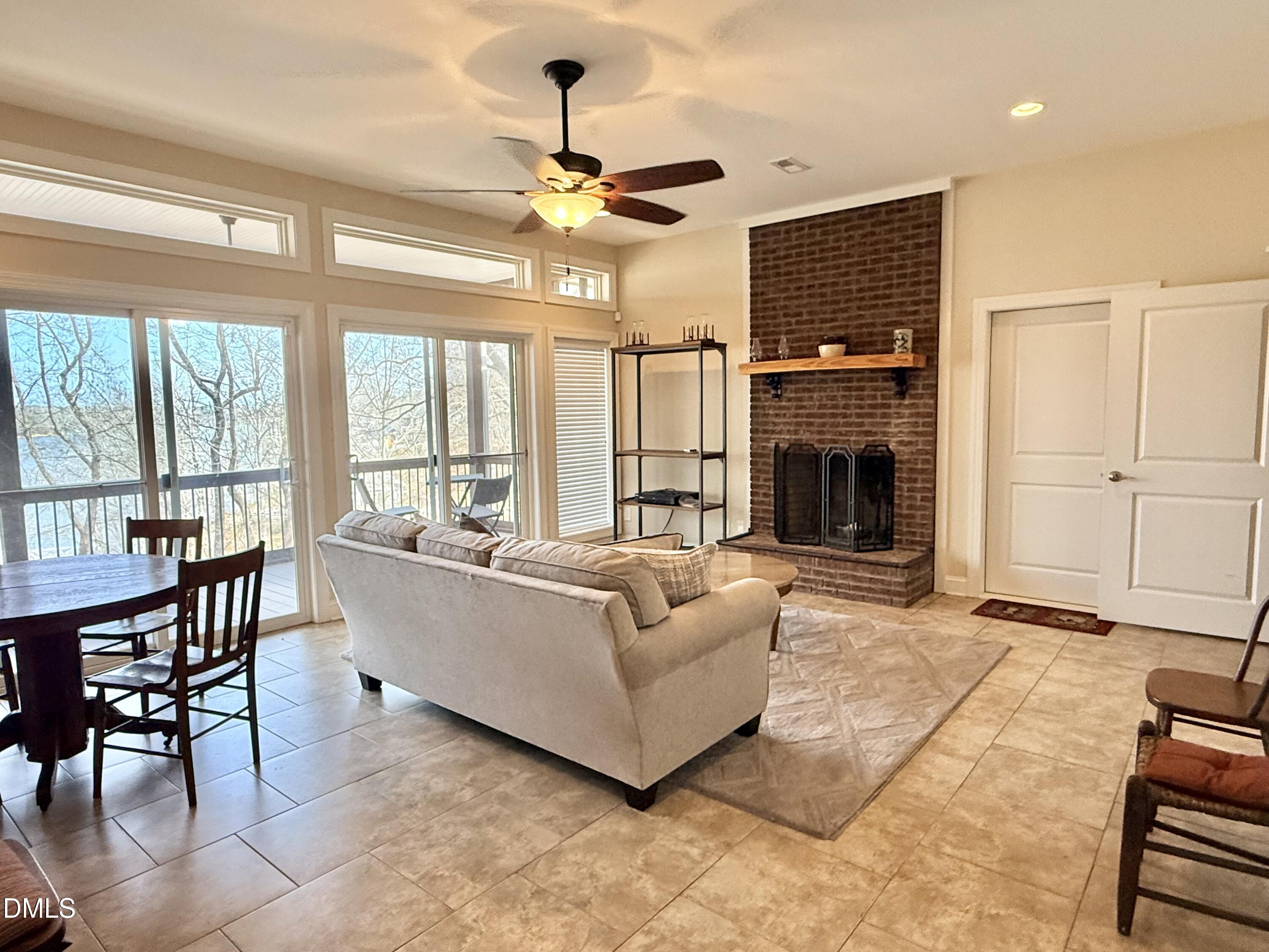 250 Bunny Rabbit Road Leasburg, NC 27291 - Photo 36 of 66 a living room with furniture fireplace and flat screen tv
