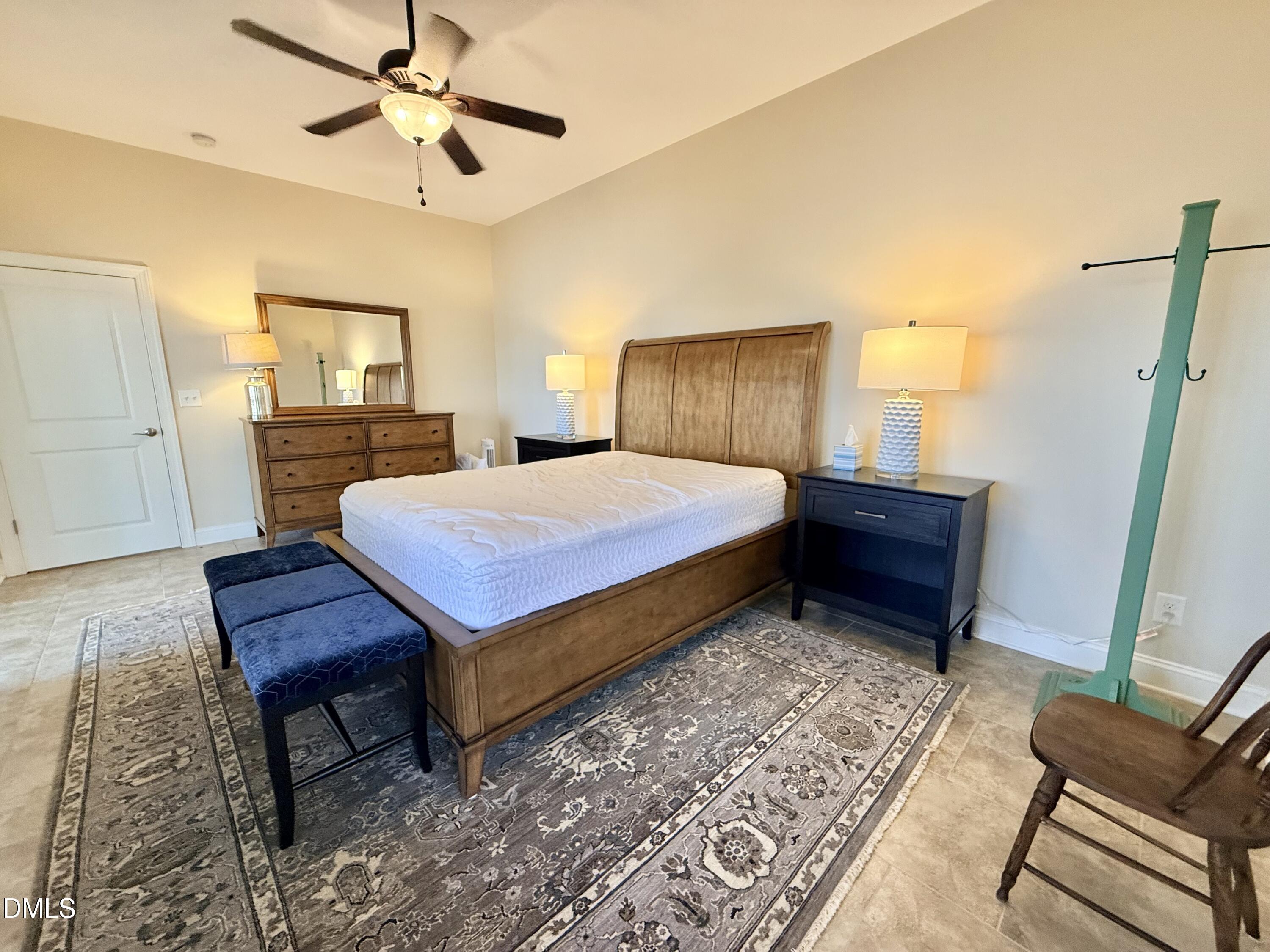 250 Bunny Rabbit Road Leasburg, NC 27291 - Photo 40 of 66 a bedroom with a bed window and a table