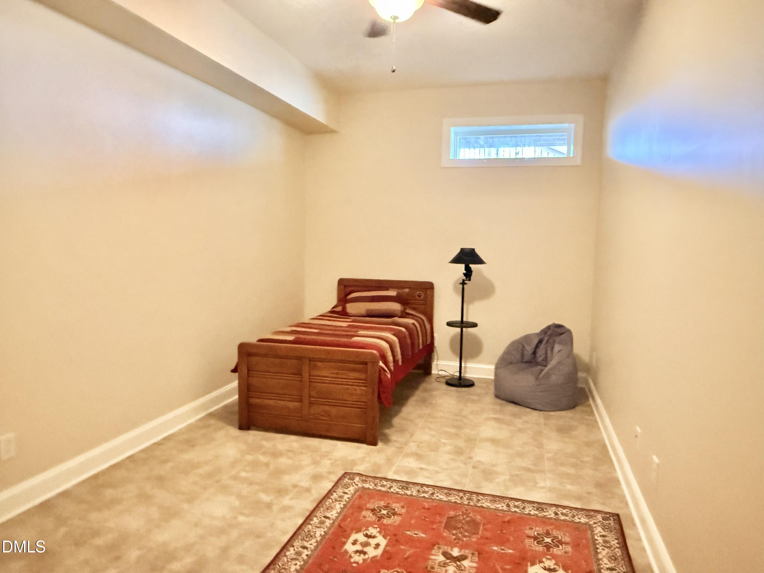 250 Bunny Rabbit Road Leasburg, NC 27291 - Photo 46 of 66 a bedroom with a bed and a window