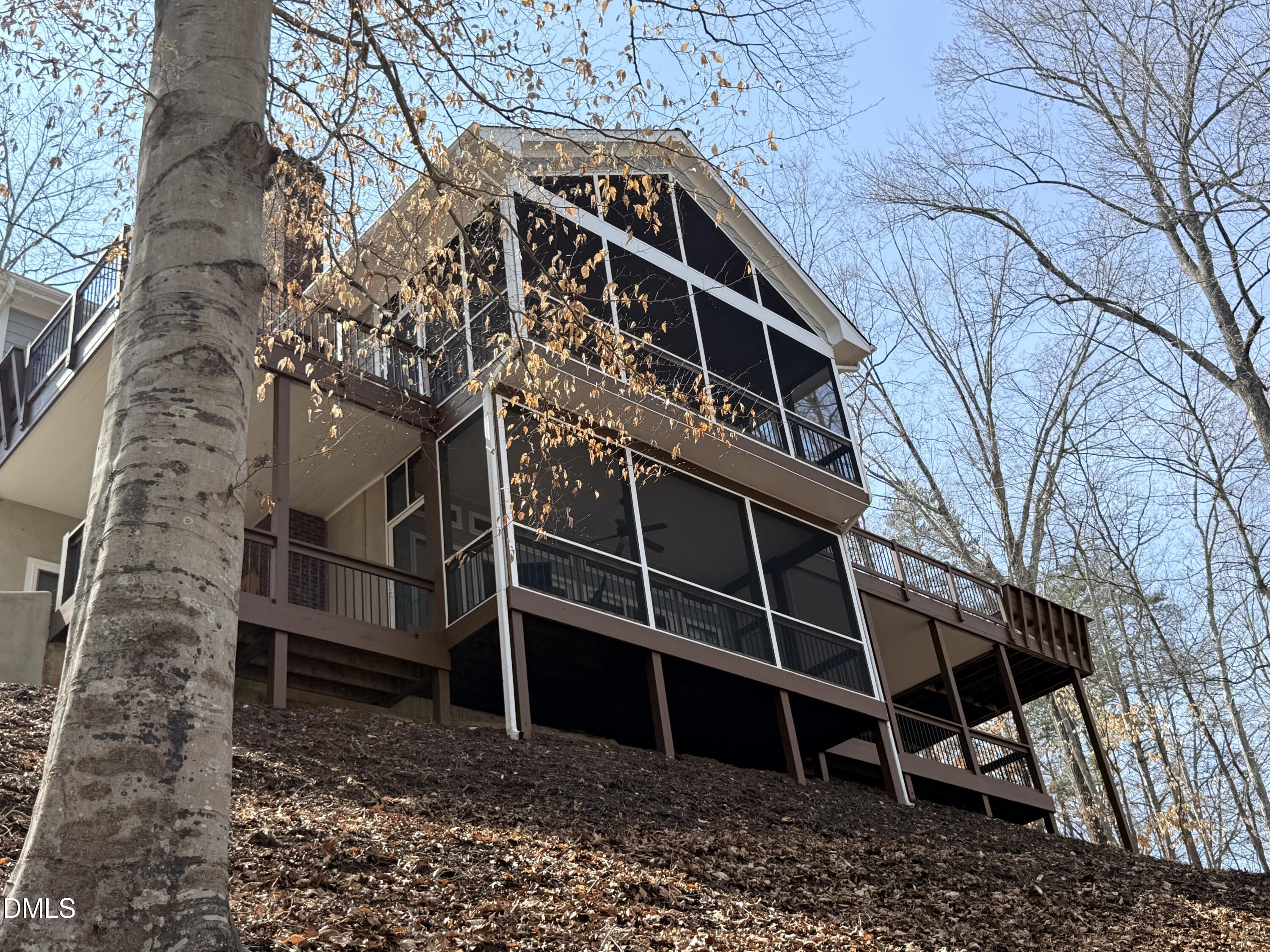 250 Bunny Rabbit Road Leasburg, NC 27291 - Photo 58 of 66 a view of a wooden house with a yard