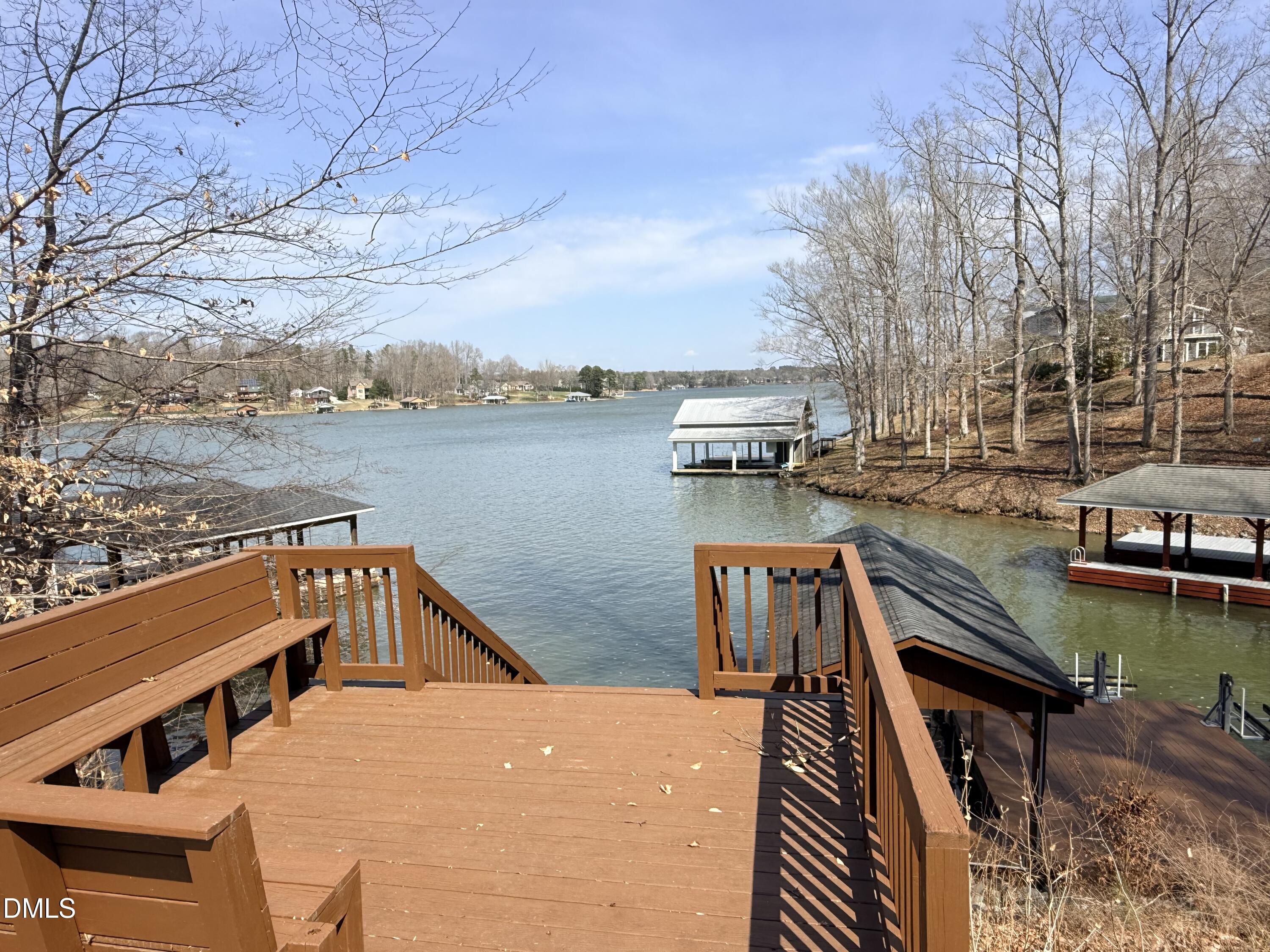 250 Bunny Rabbit Road Leasburg, NC 27291 - Photo 59 of 66 a view of a roof deck with chair and wooden floor