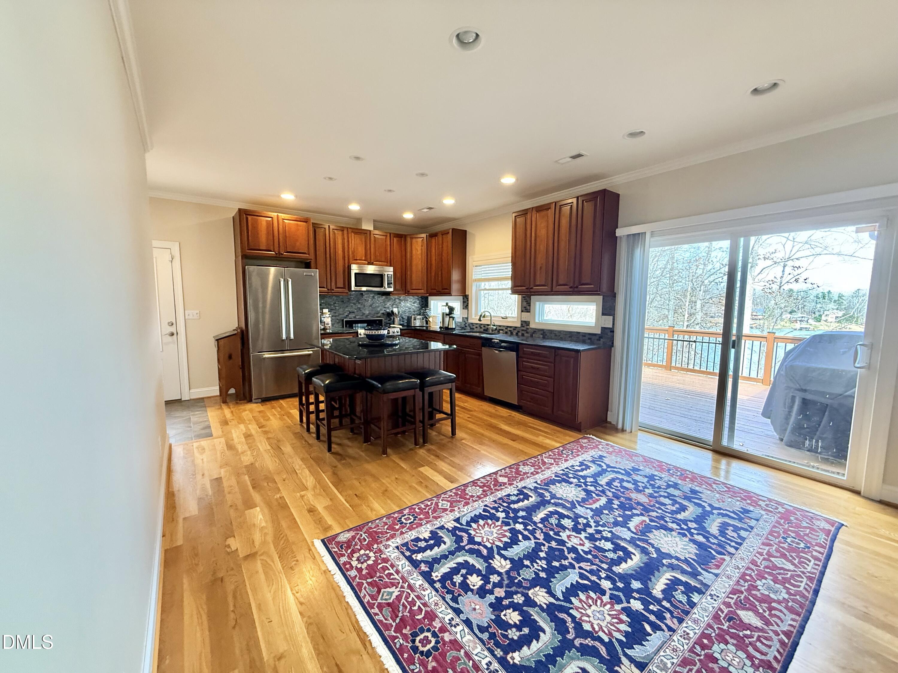 250 Bunny Rabbit Road Leasburg, NC 27291 - Photo 6 of 66 a living room with a rug and a table