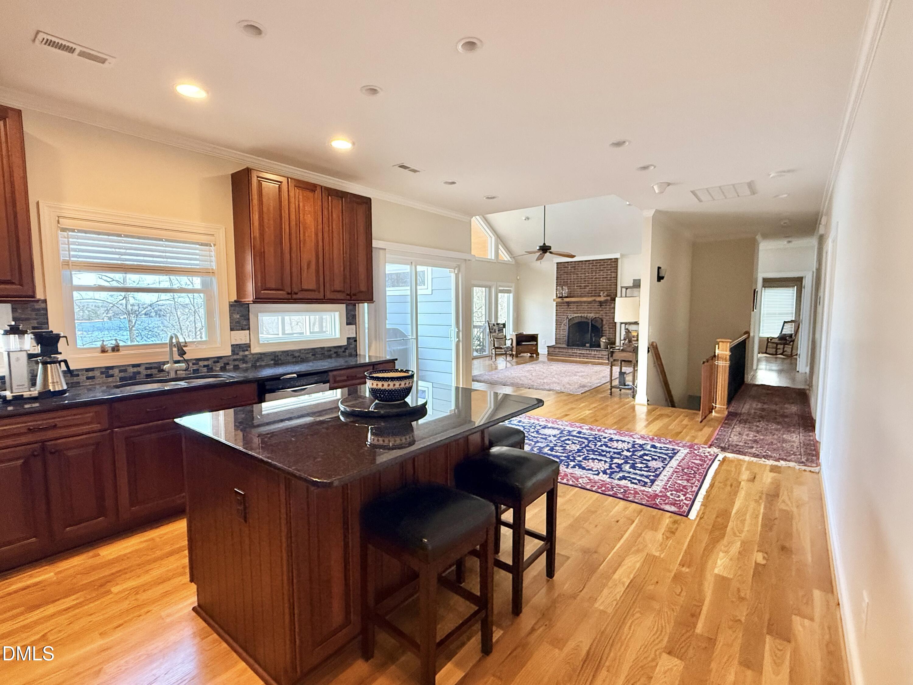 250 Bunny Rabbit Road Leasburg, NC 27291 - Photo 8 of 66 a kitchen with stainless steel appliances granite countertop sink stove refrigerator and cabinets