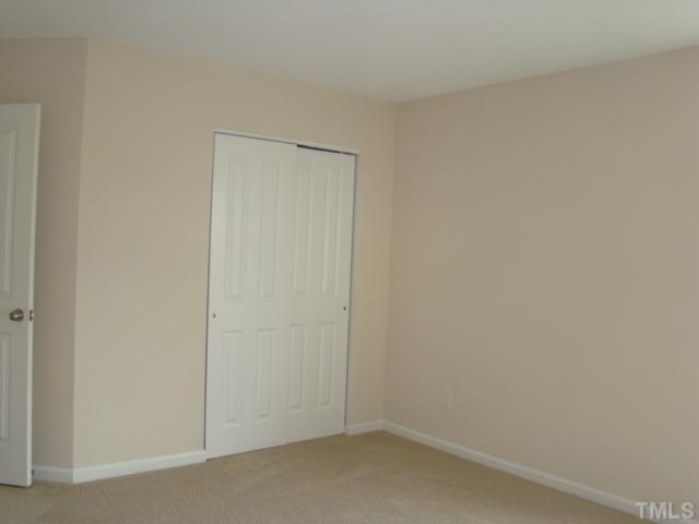 6834 Harter Court Raleigh, NC 27610 - Photo 5 of 17 a small space with a door