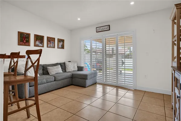 a bedroom with a baby crib and a wooden floor