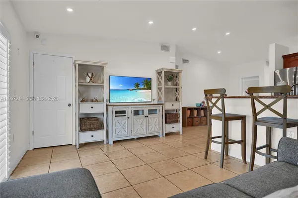 a bedroom with furniture and a window