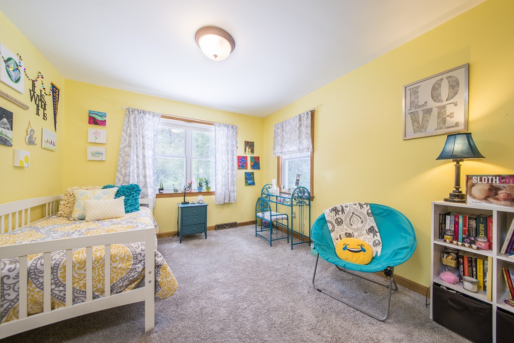 118 Wales Road Monson, MA 01057 - Photo 15 of 30 a bedroom with furniture and a book shelf