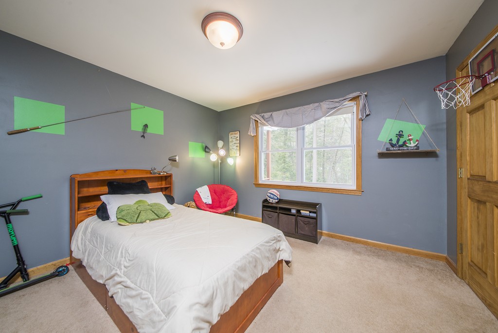 118 Wales Road Monson, MA 01057 - Photo 17 of 30 a bedroom with a bed and a table