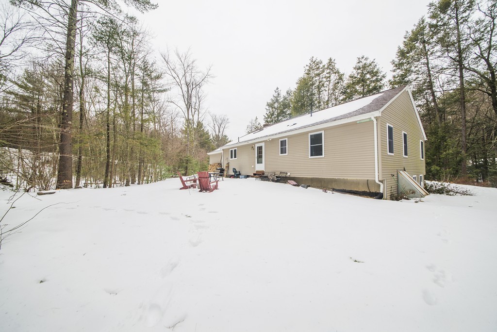 118 Wales Road Monson, MA 01057 - Photo 26 of 30 a view of a white house with snow on the road