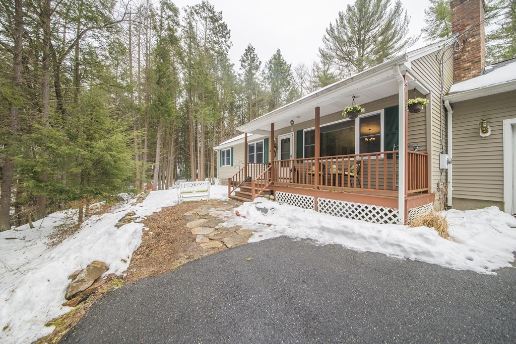 118 Wales Road Monson, MA 01057 - Photo 28 of 30 a front view of a house with a yard and wooden fence
