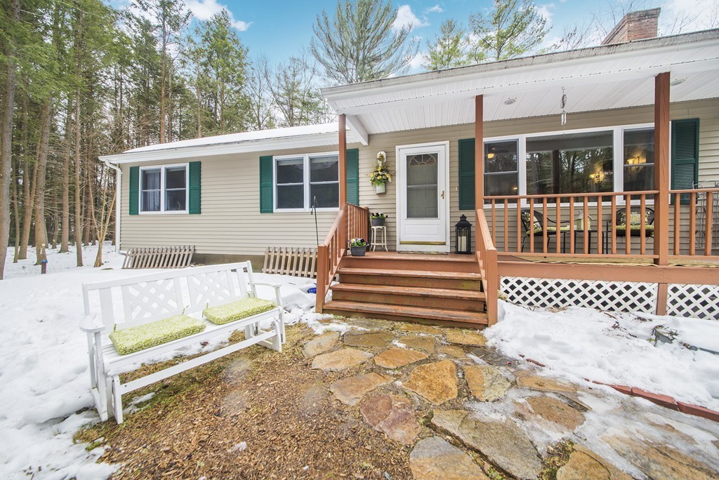 118 Wales Road Monson, MA 01057 - Photo 29 of 30 a front view of a house with a bench in front of it