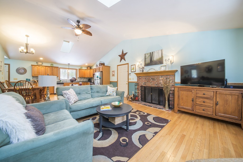 118 Wales Road Monson, MA 01057 - Photo 3 of 30 a living room with furniture a flat screen tv and a fireplace