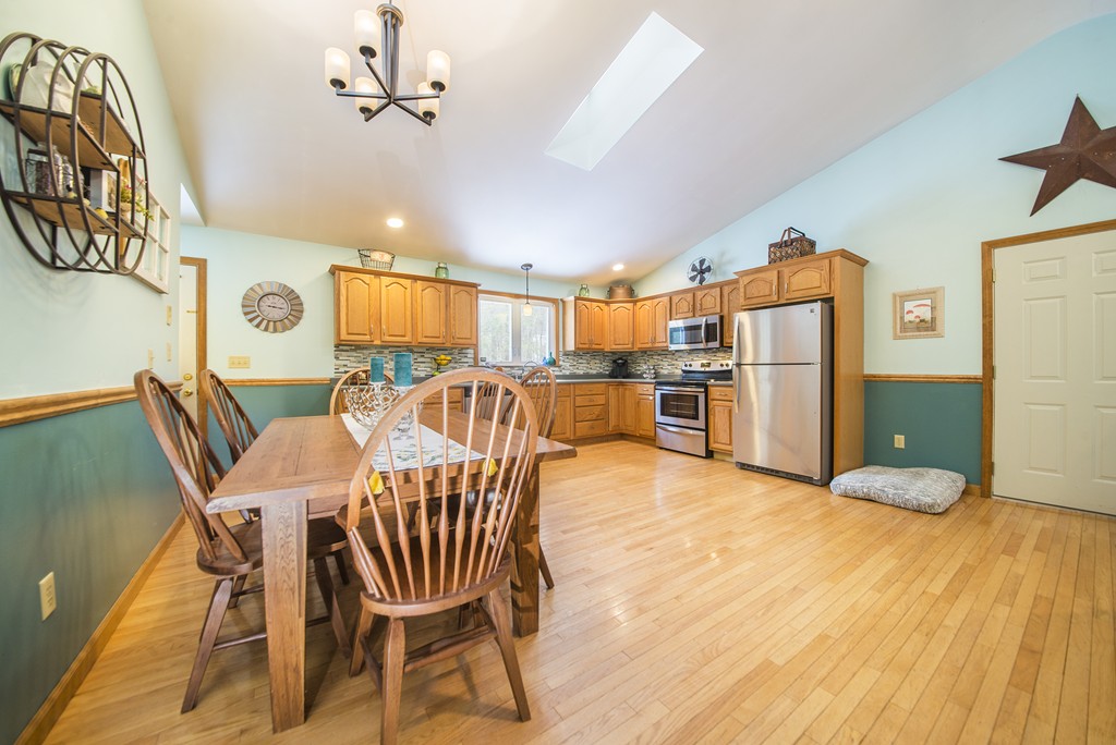 118 Wales Road Monson, MA 01057 - Photo 8 of 30 a view of a dining room with furniture and chandelier