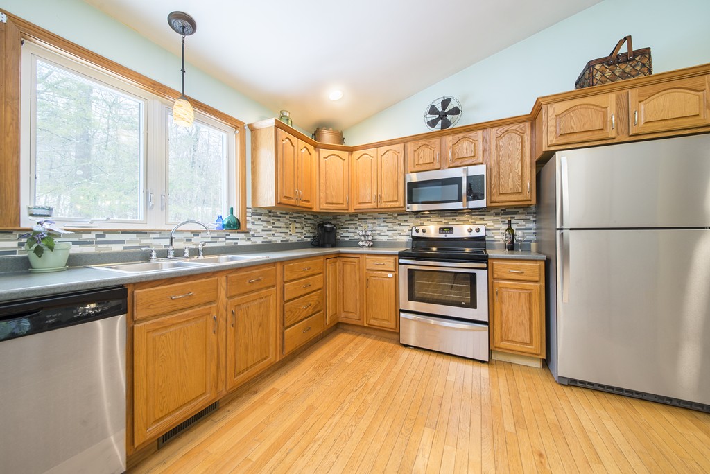 118 Wales Road Monson, MA 01057 - Photo 10 of 30 a kitchen with wooden floors and white appliances